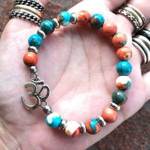 Om sign bracelet . Om charm orangy blue white jasper beads